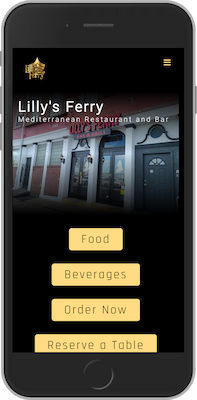 A cell phone of a laptop with the background of Lilly's Ferry Homepage
